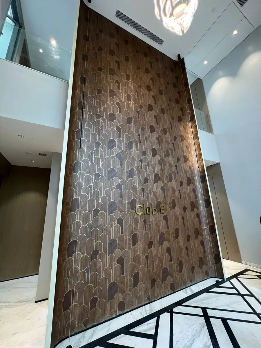 Clubhouses — Club signage on a textured feature wall