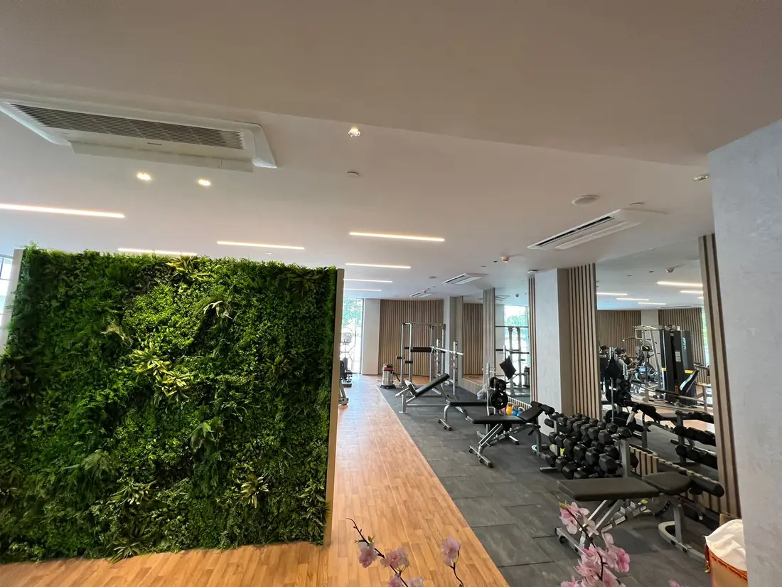 Clubhouses — Gym with a vertical green wall