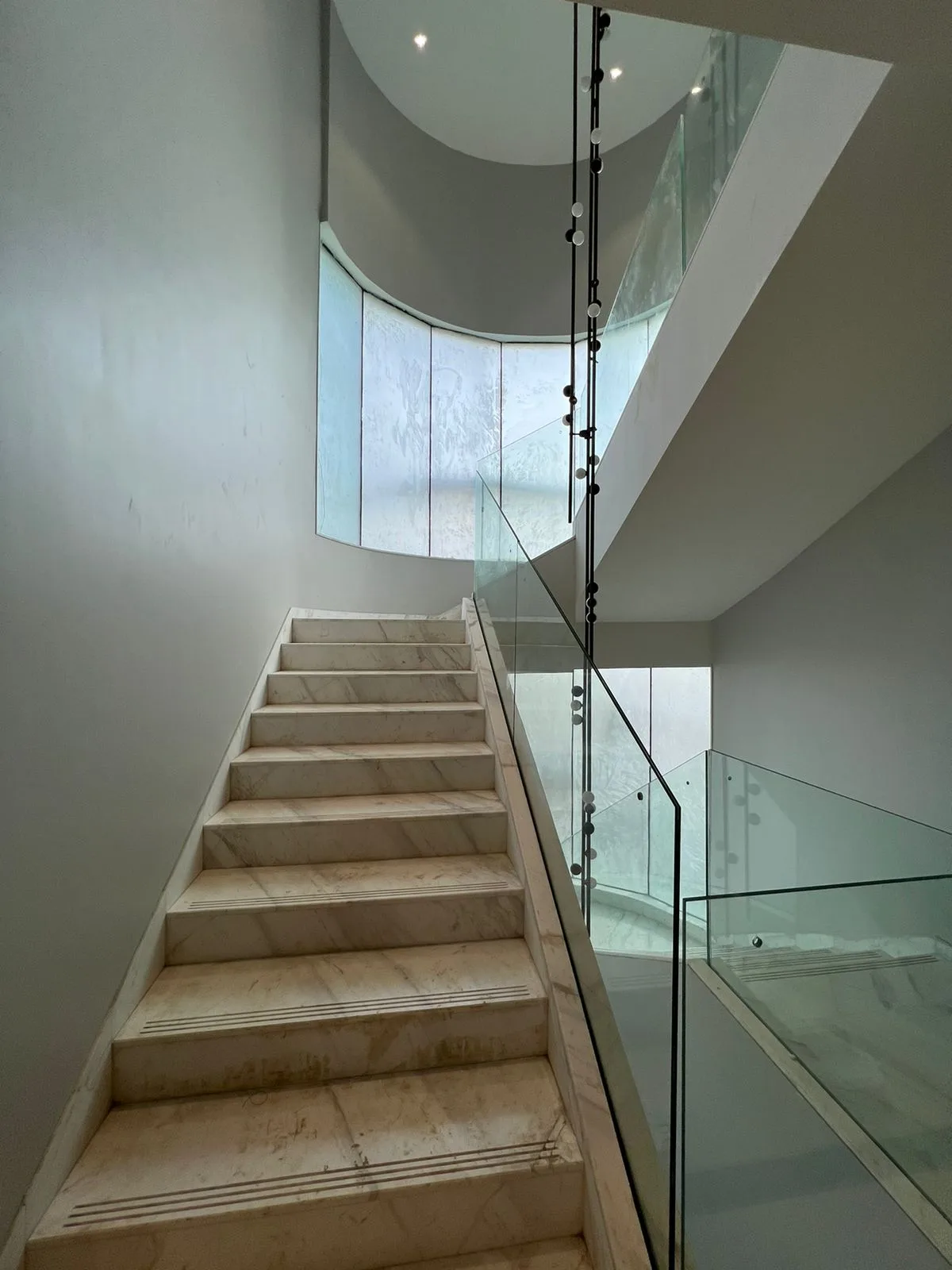 Clubhouses — Marble staircase with glass railing