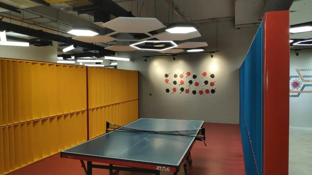 Clubhouses — Table tennis room with yellow lockers