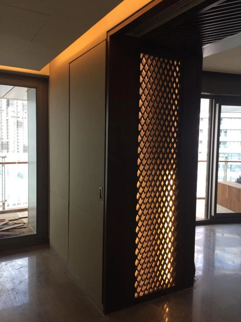 Commercial Interiors — Backlit jaali partition with wall panelling
