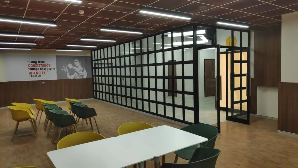 Commercial Interiors — Cafeteria with black-framed glass partition