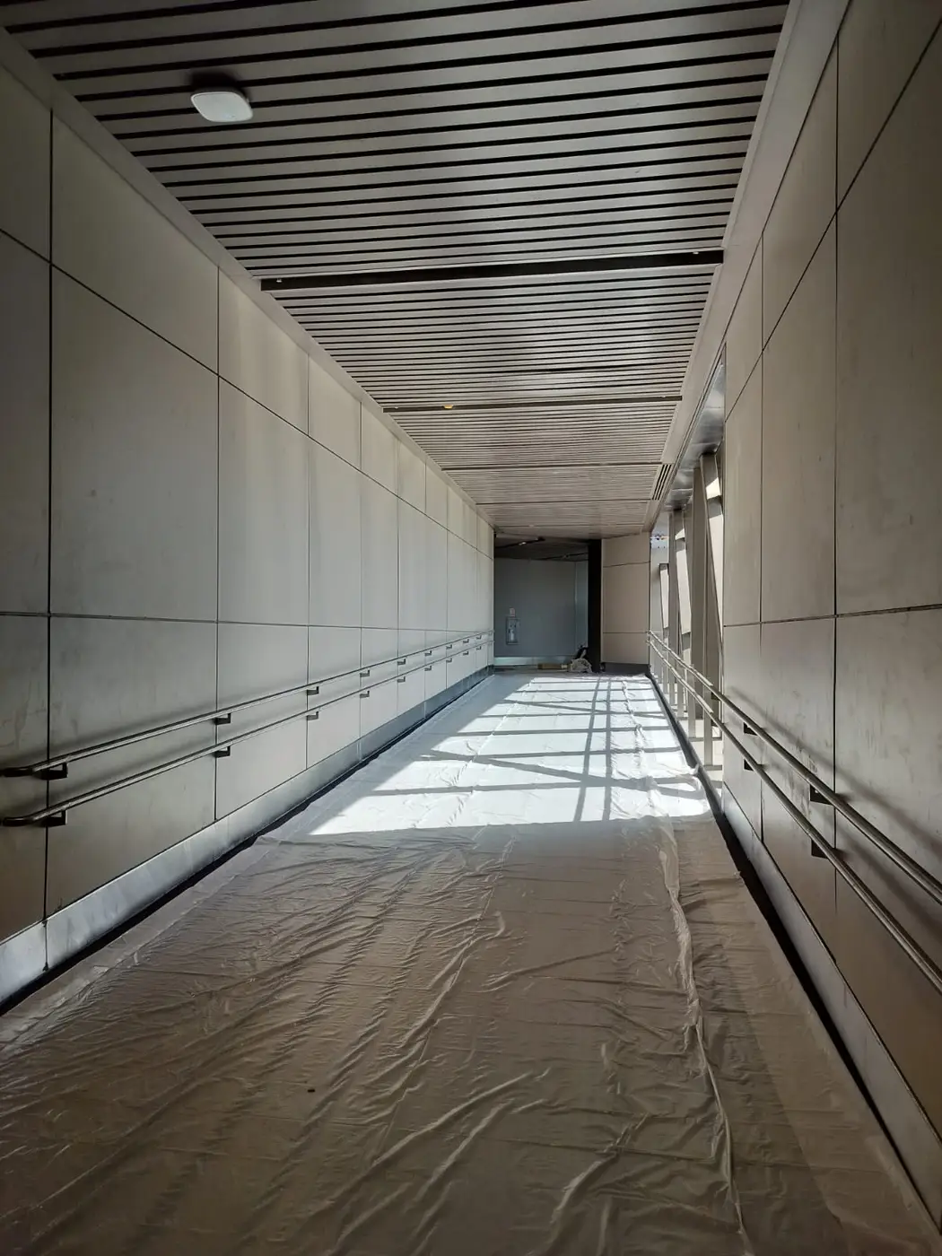 Commercial Interiors — Corridor with slatted ceiling and wall panelling