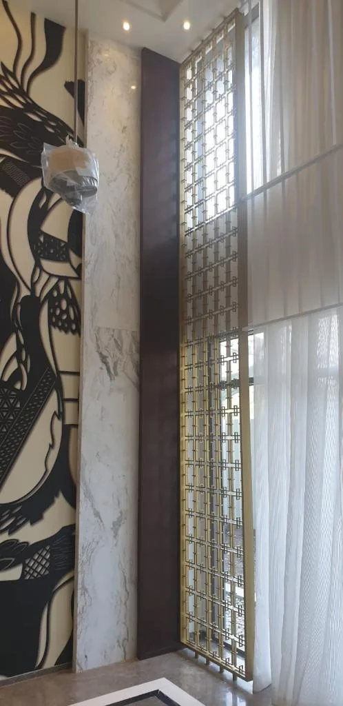 Entrance Lobbies — Lobby feature wall with decorative metal screen
