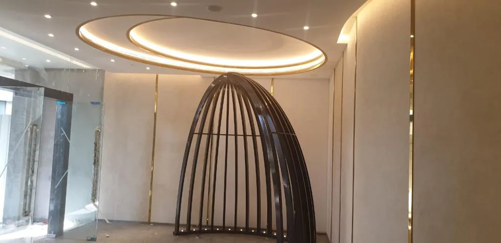 Sculpted oval false ceiling with recessed lighting