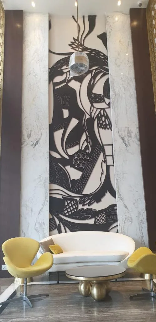 Entrance Lobbies — Lobby seating in front of an artistic feature wall