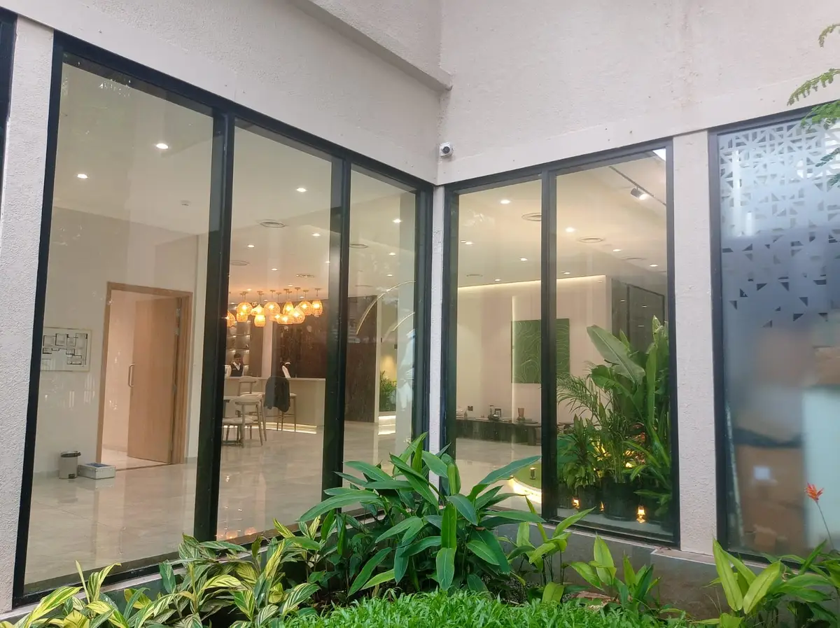 FACADE Works — Glazed frontage looking into a furnished lounge