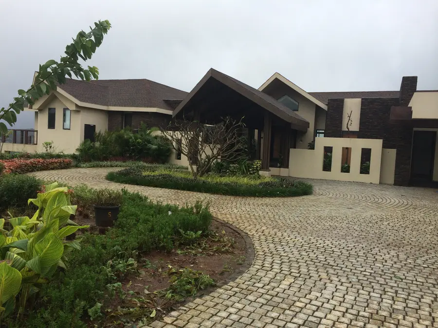 Hardscape Works — Bungalow with cobblestone driveway and landscaping