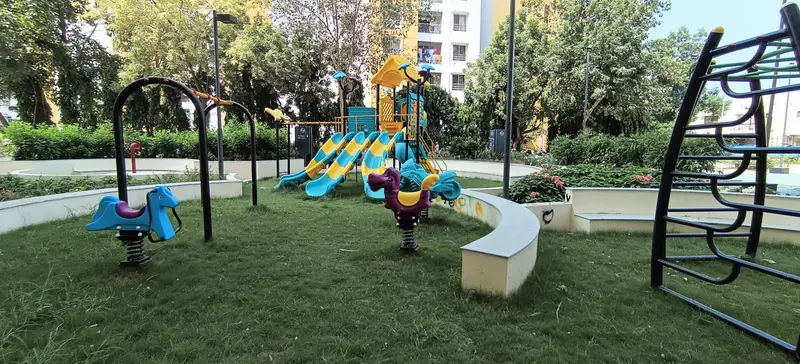 Hardscape Works — Children's play area on a landscaped lawn