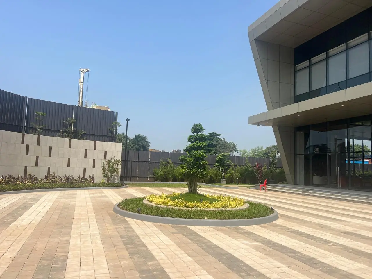 Hardscape Works — Paved forecourt with a circular planter