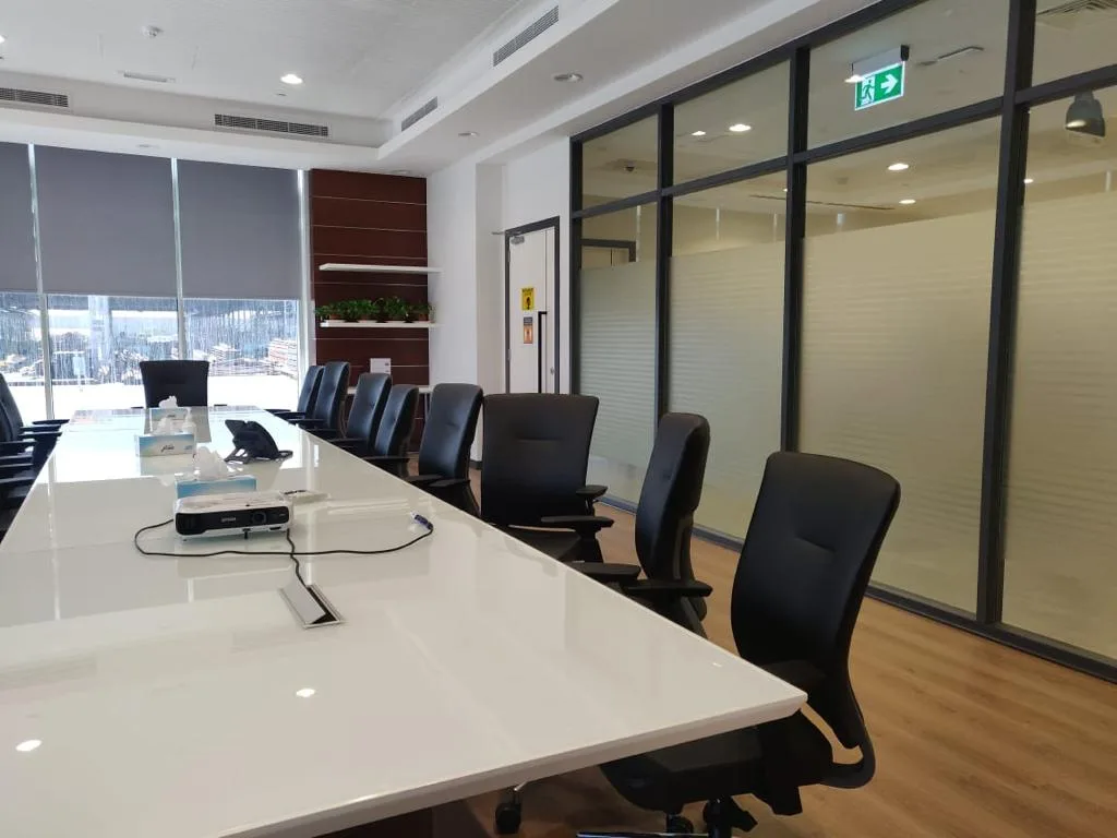 Modular Furniture — Conference table beside glass partitions