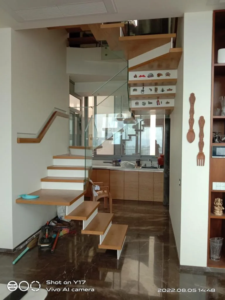 Residential Interiors — Floating staircase with view of the kitchen