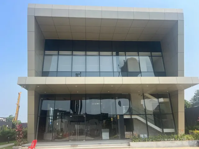 FACADE Works — Commercial building with glazed facade and cladding