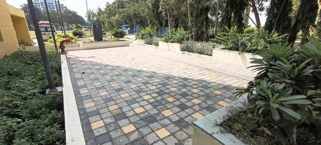 Hardscape Works — Paver block walkway with planters